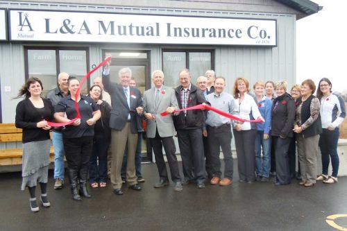 president, board members and staff from L& A Mutual Insurance celebrate the official opening of their new branch office located in the Harrowsmith Plaza